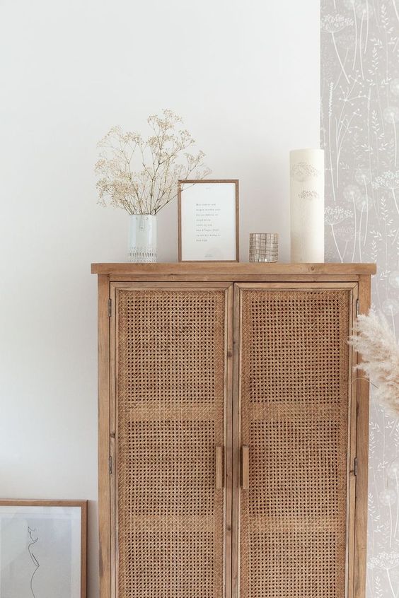 Natural rattan panelled cupboard