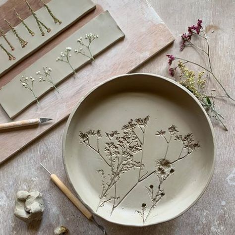 Pottery plates dried flowers imprinted into clay