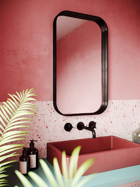 Two tone coral bathroom wall with terrazzo finish