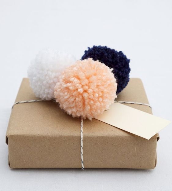 20 Creative Ways To Gift Wrap Your Presents This Christmas - PomPom Topped Present