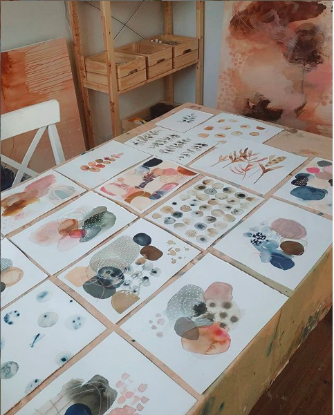 Laura Horn's art work spread over her work table